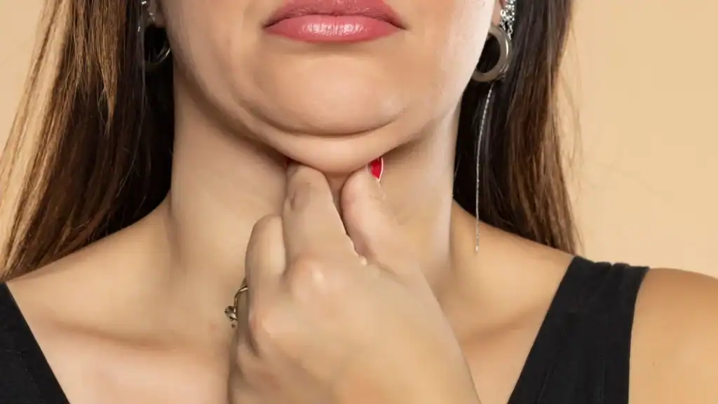 An image of a woman with double chin, sad, worried : Non Surgical Double Chin Removal Treatment in Cranleigh, UK